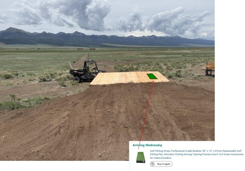 The Summit #10 tee box with custom plank windmill and mountain views